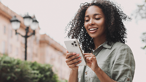 Person checking their Keesler Checking Saver account on their phone.